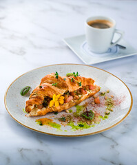 Croissants with soft cheese, salted salmon and green salad