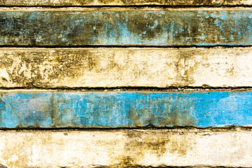 Fototapeta na wymiar Old and dirty white blue horizontal striped wall in grunge style