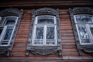 windows in an old wooden house, russian north architecture design