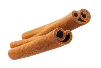 Two delicious cinnamon sticks, isolated on white background