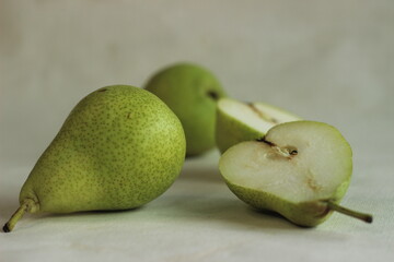 Juicy flavourful green colour pears along with cut slices