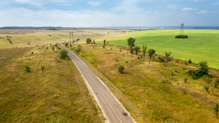 Aerial view of a highway going through agricultural fields in Belogorye, Voronezh region