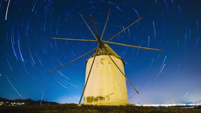 Old Spanish windmill at night. Star Trail. Spain - 4K Time-lapse