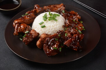 Homemade Filipino Adobo Pork with White Rice. Close-up shot of Filipino style adobo.