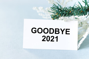 Bye, bye 2021 words on a card on a light background