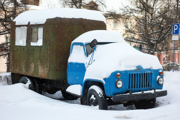 Old Soviet truck covered with snow