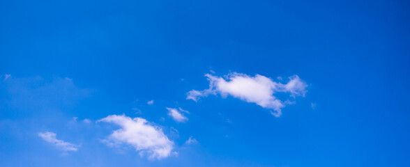 Fototapeta na wymiar blue sky background with small clouds.