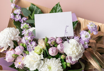 Decorative floral composition with chrysanthemums, carnations, roses, golden leaves and blank greeting card, invitation. Love, anniversary, Valentines day concept