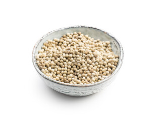 Whole pepper spice. White peppercorn grain in bowl