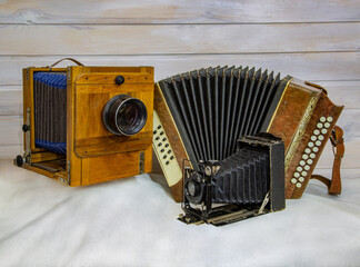 Vintage accordion and retro camera