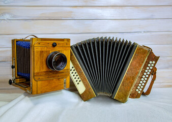 Vintage accordion and retro camera