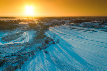 Winter evening in the countryside. Aerial view