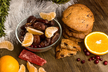 Tea with orange, oranges, dates, cinnamon, dried popaya, cranberries