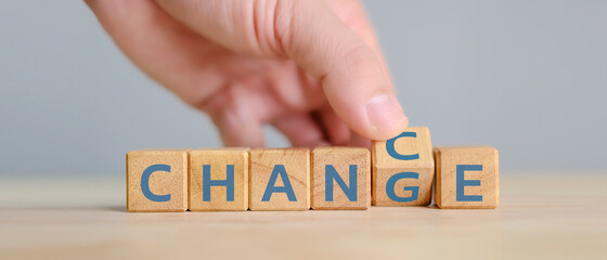 Hand flip wooden cube with word change to chance, Personal development and career growth or change...