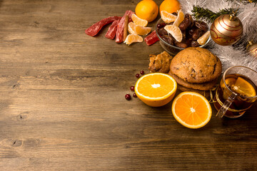 Tea with orange, oranges, dates, cinnamon, dried popaya, cranberries