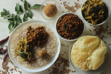 Rice porridge or Kanji along with spicy coconut red chilly chutney, stir fried boiled red cowpea...