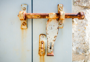 Old rusty lock on a wooden door