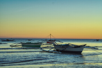 Dawn at Bulalacao fishing village, Oriental Mindoro. sunrise soon. The village comes to life and the net fishing begins again.  Traditional fishing and the main income for the village