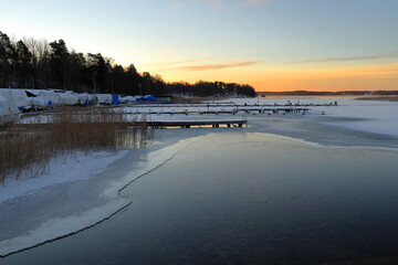 Beautiful winter photo. Swedish frozen lake called Mälaren or Malar. Stockholm, Sweden, Europe.