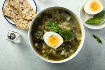 Traditional homemade green soup with hard boiled eggs	
