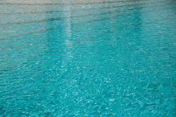 Wave pattern. Close-up of the water surface of the pool close up. Crystal texture
