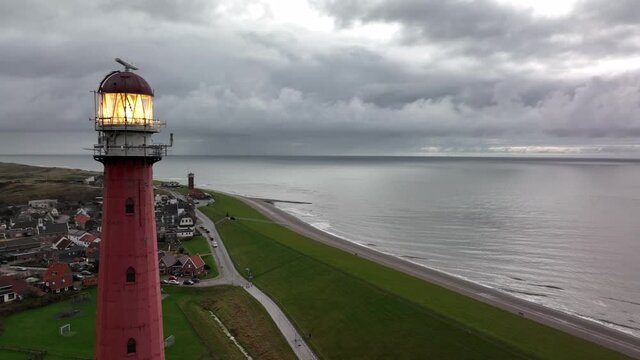 Lighthouse tower Lange Jaap in Den Helder drone aerial footage along the sea near the island of Texel in North Holland, The Netherlands.