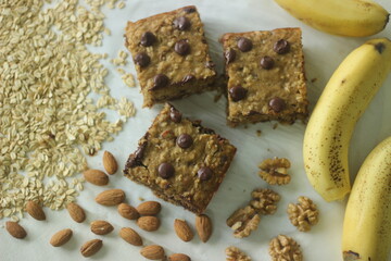 Oats banana breakfast bar sliced to square shape. A quick and healthy snack with rolled oats, whole...