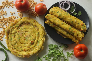 Besan chilla or chickpea pancakes. These are protein rich savoury pancakes made of besan flour or chick pea flour - obrazy, fototapety, plakaty