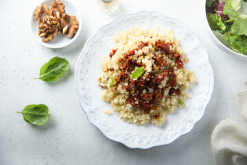 Homemade couscous with sun dried tomatoes and walnut