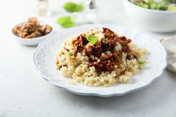 Homemade couscous with sun dried tomatoes and walnut