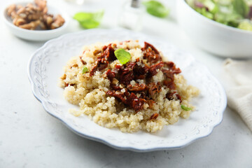Homemade couscous with sun dried tomatoes and walnut