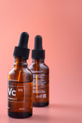 Bottles made of dark glass. Serum for the skin. Vitamin C.