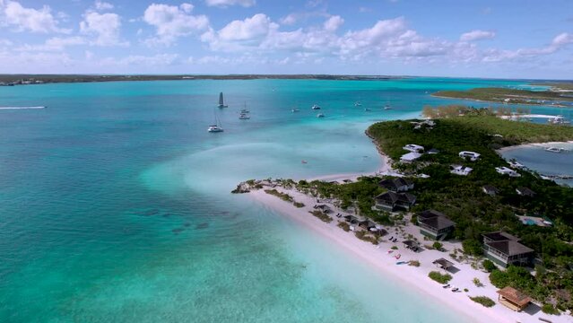 The drone aerial footage of  yacht anchoring in crystal clear turquoise water, Stocking Island, Great Exuma, Bahamas.
