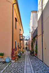 Fototapeta na wymiar A street among the characteristic houses of Buonalbergo, a mountain village in the province of Benevento, Italy.