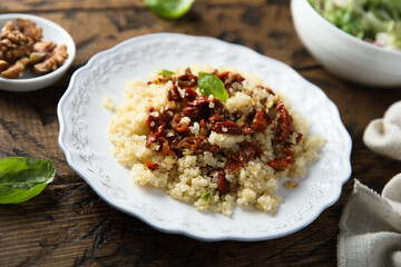 Homemade couscous with sun dried tomatoes and walnut