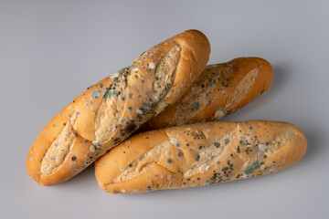 Moldy bread on blurry background. food fungus. Dirty food that is unappetizing.