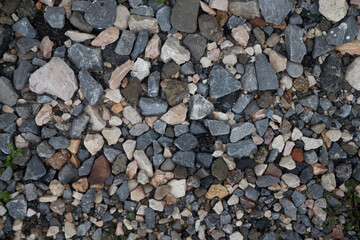 Stone wall background. Scatter of various stones. Various stones. Stones are laid out on the ground