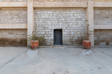 The entrance  to the St. John the Baptist Monastery of the Franciscan Order near Israeli side of of Qasr El Yahud, in the Palestinian Authority, in Israel - obrazy, fototapety, plakaty