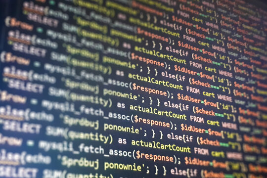 Structured sql code on monitor. SQL code on a dark background development concept