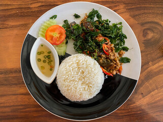 Rice topped with stir-fried pork and basil.Thai food