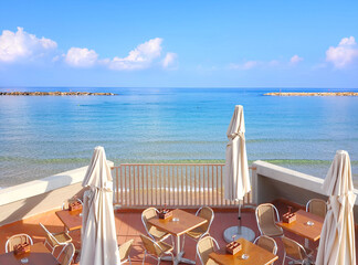 Cafe by the sea. View of the morning calm sea