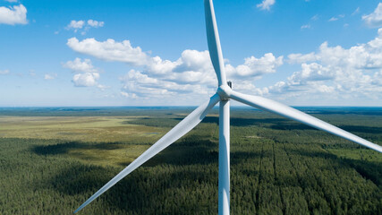 Wind turbine renewable energy source summer with blue sky and clouds. © raland