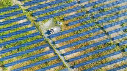 Solar panels on field in summer, aerial view of Finland, Europe. Solar cells energy farm in...