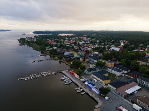 Aerial view of beautiful city in Finland at sunset. City streets of Kristiinankaupunki and low old styled houses, nordic architecture.