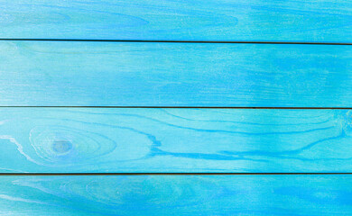 Obraz premium Blue horizontal vintage wooden board. Front view with copy space. Background for design. Old painted wood abstract background.