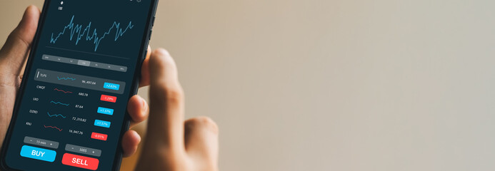 Businessmen work with stock market investments using smartphone to analyze trading data. smartphone with stock exchange graph on screen. Financial stock market. banner image size.