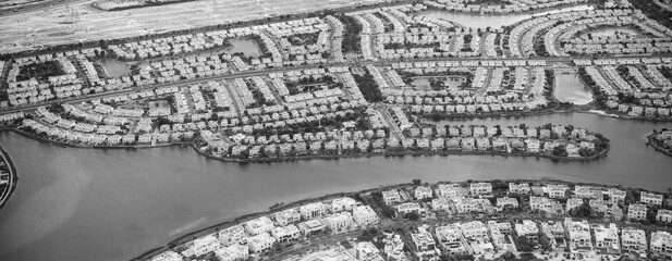 Aerial view of Dubai small homes along the water.
