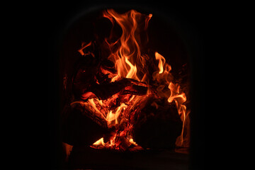 A fire burns in a fireplace. Fire to keep warm.