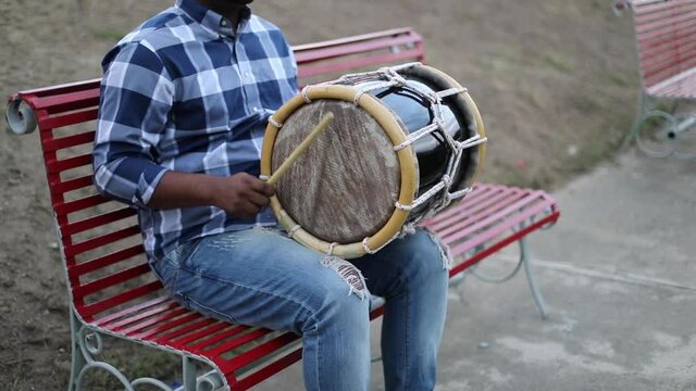 dominican man playing tambora merengue