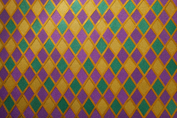 Shiny green, purple and golden glittering paillettes diamonds fabric. Mardi Gras holiday background. - obrazy, fototapety, plakaty